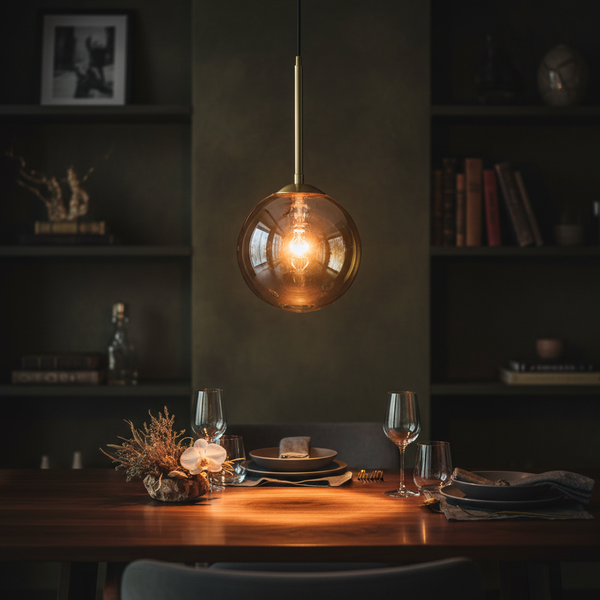 TimelessGlow G25 amber LED globe bulb glowing warmly above a dark wood dining table in a moody, intimate interior